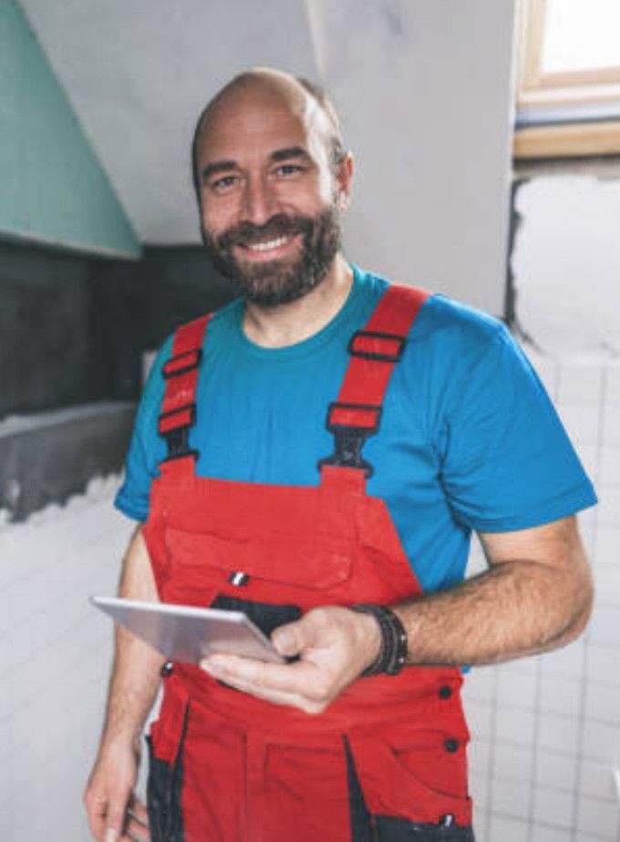 Master tiler in Swansea smiling confidently.